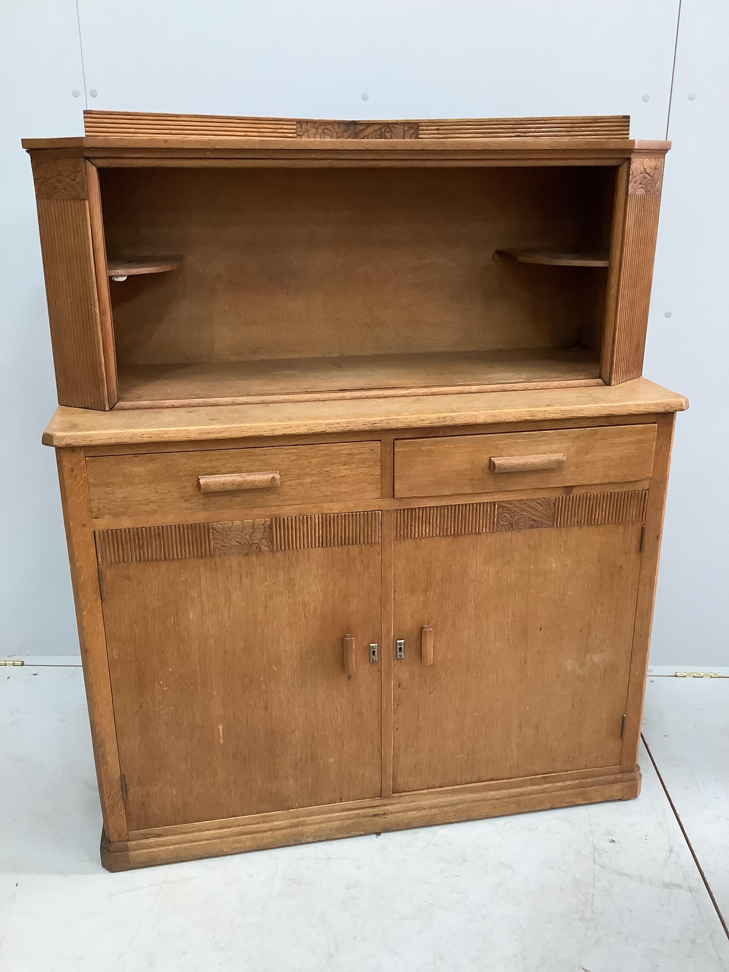 An Art Deco oak side cabinet, width 105cm, depth 43cm, height 127cm